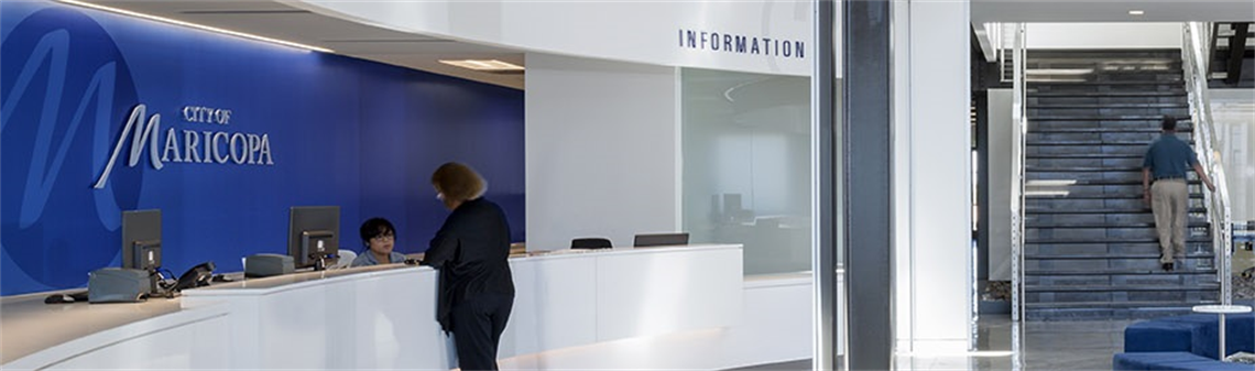 Interior photograph of City Hall with blue wall and 