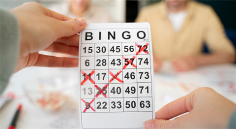 Stock image of a bingo game card with a diagonal bingo marked in red marker