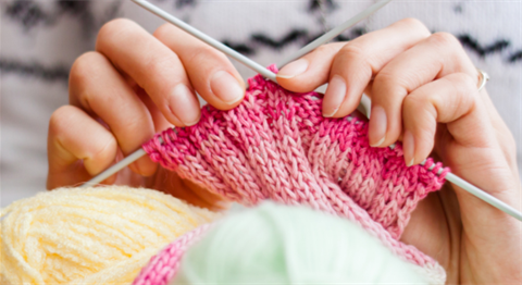 Generic image of hands holding a knitting project