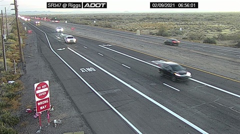 Desert highway scene at dawn with traffic on SR347. A 