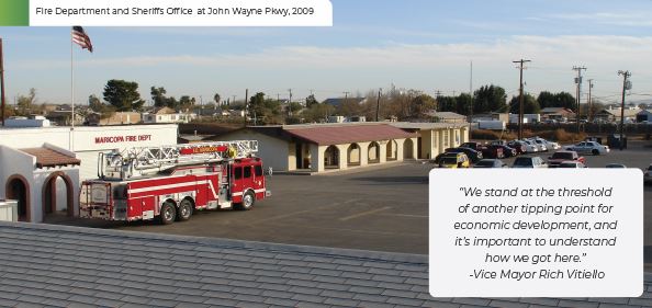 A fire truck is parked outside the Maricopa Fire Department on John Wayne Parkway. An American flag waves above. Quote from Vice Mayor Rich Vitiello is displayed.