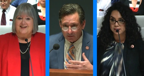 Three people in a panel discussion. Left: Woman in a red blazer, smiling. Center: Man in a blue suit, speaking intently. Right: Woman in glasses, wearing a patterned top. They each have a microphone.