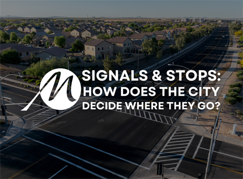 Aerial view of suburban houses and a wide, empty road intersection, with city planning text overlay: 