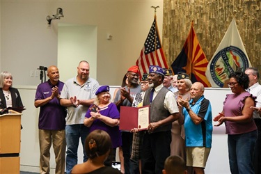 Maricopa Mayor Nancy Smith and City Council members pose with the Purple Heart Day proclamation during a council meeting.