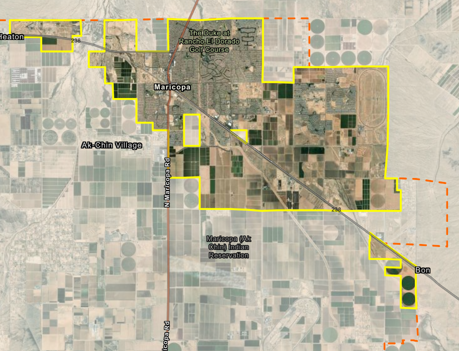 A detailed map showing Maricopa, Arizona, with outlined boundaries of agricultural land and various roadways. The area features patches of farmland in different shades of green and brown, with labels for notable locations such as Ak-Chin Village and Bon.