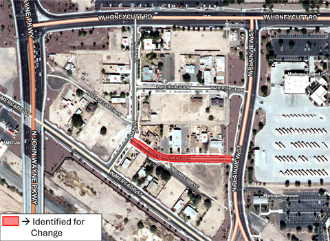 Map highlighting a section of West Cesar Chavez Lane in red, marked for change. Surrounding area includes streets, buildings, and a school.